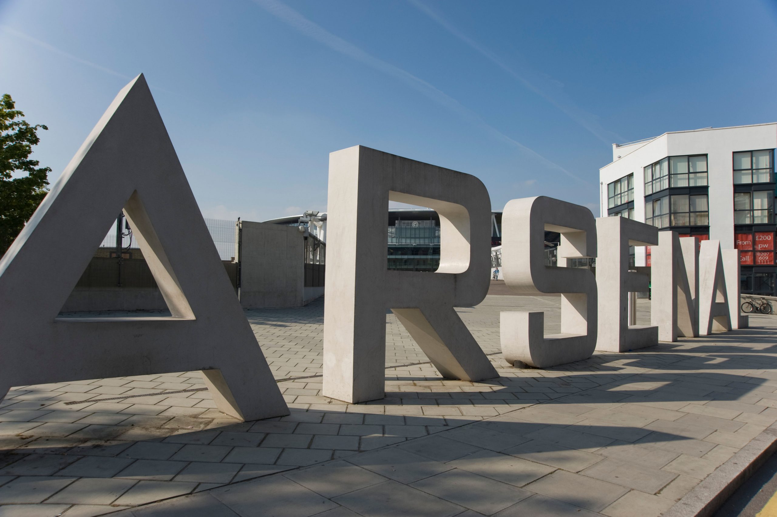 The large concrete letters spell 'Arsenal' outside the Arsenal Emirates stadium London UK